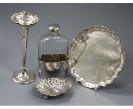 A mid 20th century silver waiter, a silver mounted flask with plated cup, a silver spill vase and a silver butter dish.