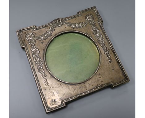 An Edwardian repousse silver photograph frame by William Hutton &amp; Sons, Birmingham, 1906, 18cm, (lacking support arm).