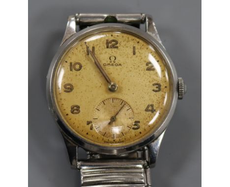 A gentleman's late 1940's stainless steel Omega manual wind wrist watch, on associated steel bracelet.