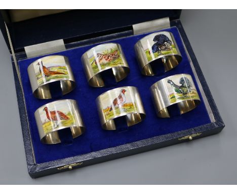 A modern cased set of six silver and enamel 'game bird' napkin rings, W.I. Broadway &amp; Co, Birmingham, 1993.