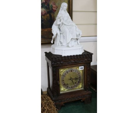 An Edwardian parian-topped oak mantel clock, figural mounts overall height 66cm