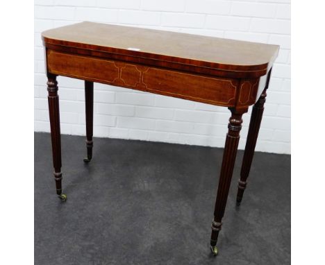 Early 19th century mahogany and inlaid card table, with plain top and green baize lining, raised on fluted supports terminati