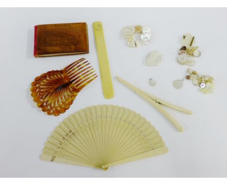 Mixed lot to include mother of pearl buttons, bone glove stretchers, early 20th century ivory page turner, hair slide and an 