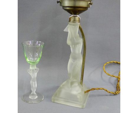 Opaque glass figural table lamp, together with a similar drinking glass, (2)