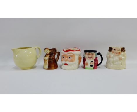 Collection of Toby jugs to include 'Father Christmas' and a Clarice Cliff cream glazed jug, (5) 