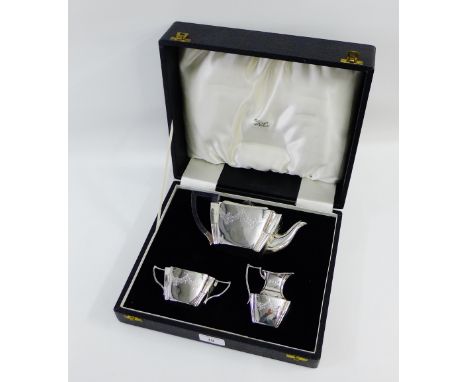 Victorian Scottish silver three piece breakfast set with bright cut garland swags comprising teapot, milk jug and sugar bowl,