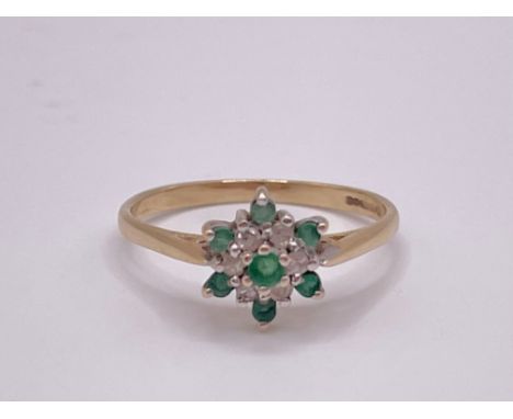 A 9ct yellow gold, white stone, and emerald cluster ring, set with seven round-cut emeralds, cluster 8mm diameter, size N, 1.