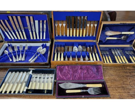 Two large sets of plated cutlery, cased (some items lacking) together with two smaller sets, an a cased set of silver plated 