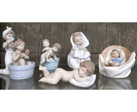 Three Lladro children groups and two Nao child figures, 11cm to 18cm. (5) 