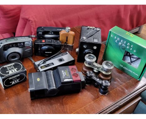 A large collection of vintage cameras, together with binoculars and hip flask. 