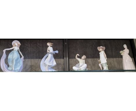 Lladro seated girl with puppy, 13cm, and two girl figures, both 22cm, Nao girl, 18.5cm, and Requena girl, 21cm. (5)Two finger