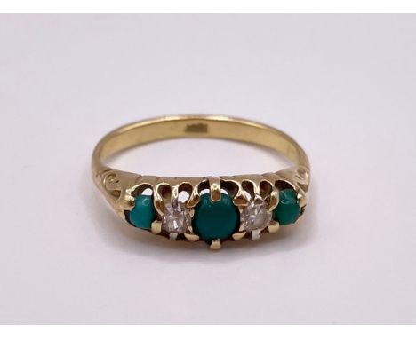 An 18ct yellow gold, diamond, and jade ring, set with three cabochon jade, a round-cut diamond and an old-cut diamond, marked