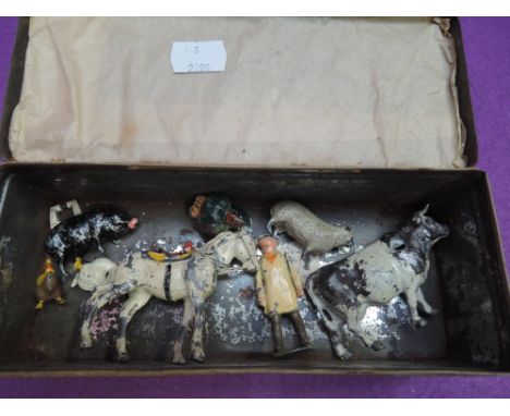 A small selection of Britains and similar figures and animals in a vintage tin