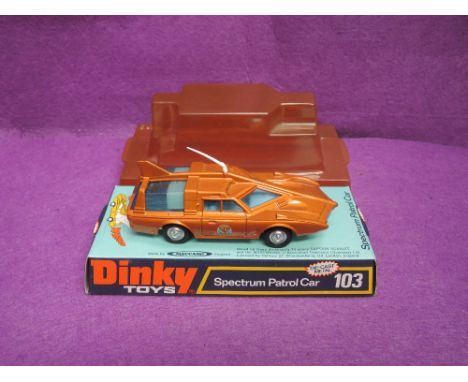 A Dinky die-cast, Spectrum Patrol Car, rare bronze finish, on bubble card display stand 103