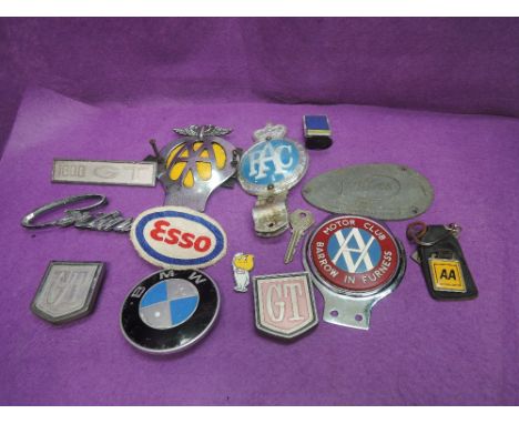 A selection of vintage car and motorcycle badges including RAC, AA, Cortina, BMW, Barrow in Furness, Villiers etc