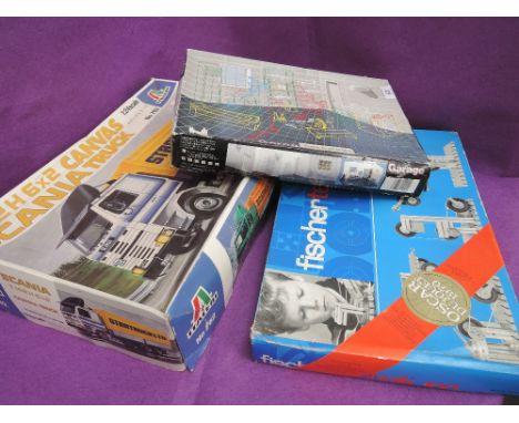 Three plastic construction kits, Italeri Scania truck, Fischer technik 100 & Fujimi garage & tools, all boxed