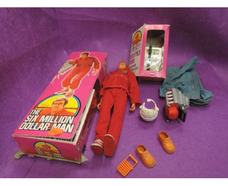 A Denys Fisher doll, Steve Austin, The Bionic Man, in original box with extra clothing and a Back pack Radio in original box