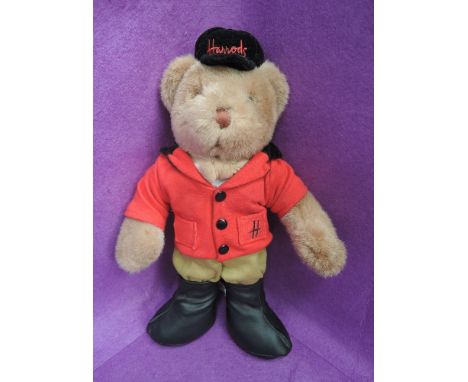 A Harrods of Knightsbridge teddy bear, wearing show jumping/ hunting attire with number 1 to reverse