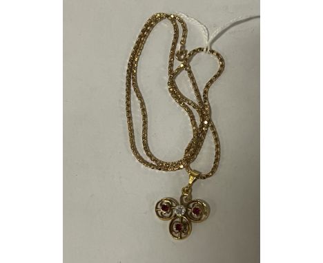9CT GOLD RUBY PENDANT WITH 9CT GOLD CHAIN SET WITH DIAMONDS 9.4GRAMS APPROX