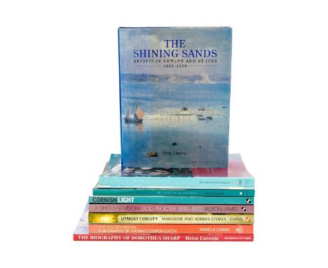 A collection of nine art books.