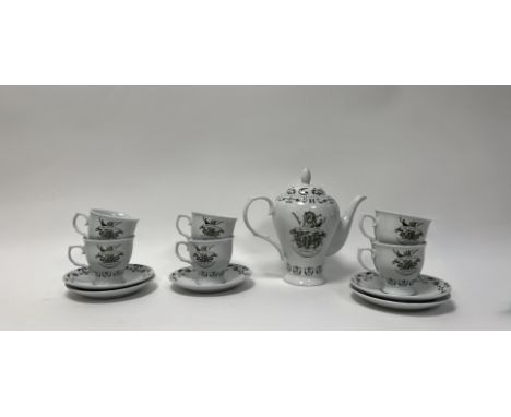 A boxed and unused promotional Hendricks Gin tea service comprising, a set of six teacups, all branded with the Hendricks log