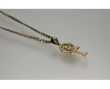An Egyptian yellow metal Ankh pendant with central scarab: l. x 3.5cm mounted on 9ct flat curb link chain with ring fastening