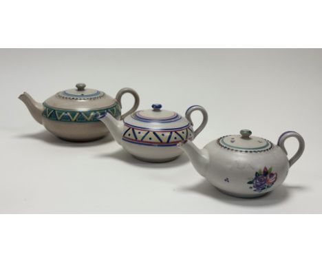 A collection of Early Carter Stabler Adams Poole Pottery teapots comprising, one with roses to centre (marked 513 and initial