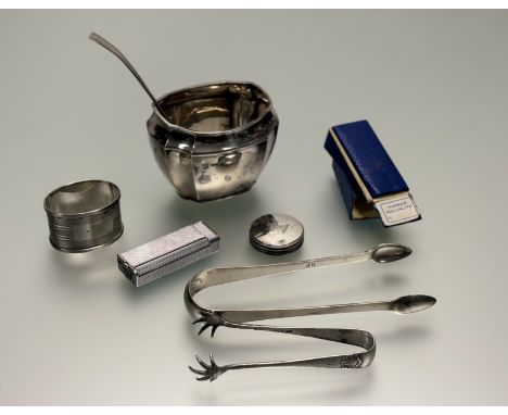A Sheffield silver panel-sided sugar bowl: h. x 7cm Sheffield 1933, a Birmingham silver oval napkin ring Birmingham 1954, a p