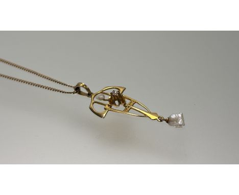 A 14ct gold Art Nouveau style open work pendant set seed pearl and diamond point and drop pearl: l. x 4cm 1.15g on 10ct gold 