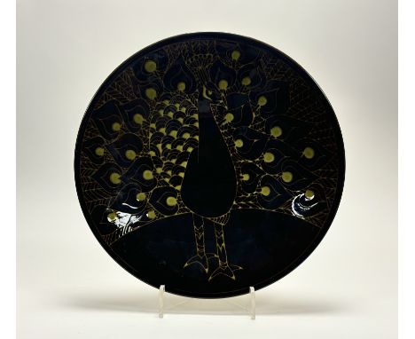 A Poole Pottery Aegean Peacock charger decorated with a green and brown glaze. (marked verso) (w-41cm)
