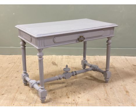 A French oak hall table fitted single frieze drawer on fluted tapered supports and circular tapered feet with urn central mou