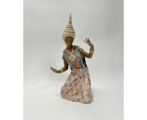 A Lladro figure of a kneeling Thai dancer (h. 43cm) 