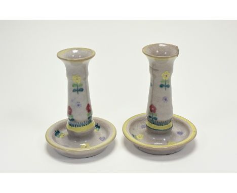 A pair of Early Carter Stabler &amp; Adams Poole Pottery candlesticks, decorated in the CV floral design by Ethel Barrett, ch