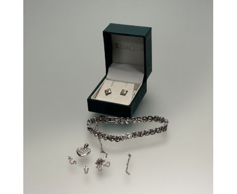 A pair of 9ct white and yellow gold offset squared stud earrings set clear stones, a white metal paste set bracelet and: d. x