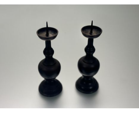 A pair of late 19thc Japanese Buddhist altar fitting bronze candle stands, marked verso (h-19cm). (2)