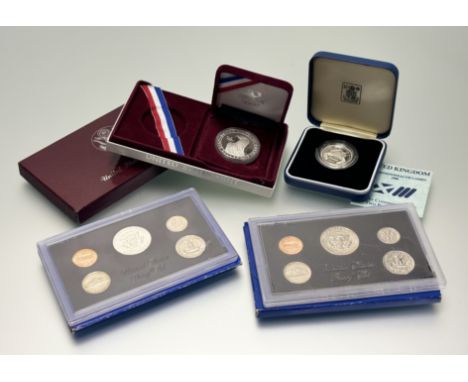 A 1983 United States silver one-dollar Los Angeles proof XXIII Olympics commemorative coin in original presentation box: d. x