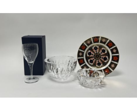An Orrefors footed clear crystal bowl with bands of stylised leaf cuts (h. 10cm x d. 16.5cm) (marked verso), together with a 