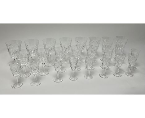 A large collection of Waterford crystal glasses with faceted stems and cut crystal decoration to bowl comprising, a set of ei