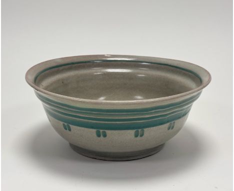 An Early Carter Stabler &amp; Adams Poole Pottery bowl,with green banding and green dotts on celedon ground in the LP pattern