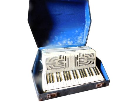 A Hohner Verdi III piano accordion, in a fitted case. 