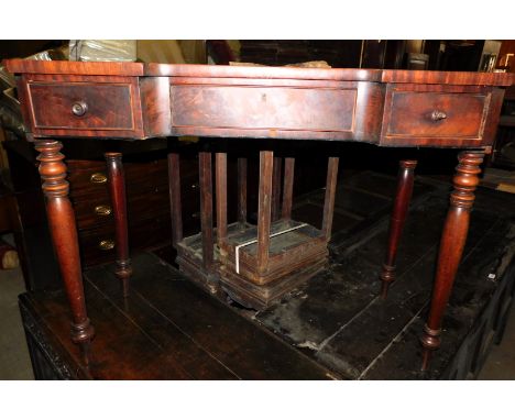 A 19thC inverted breakfront side table, with a shaped top above three frieze drawers, two with turned wooden handles, on turn