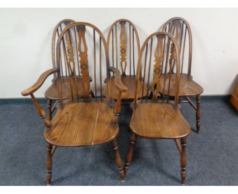 A set of five Windsor kitchen stick back chairs comprising of one carver, four singles (as found) 