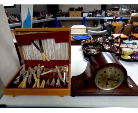 A canteen containing plated cutlery together with a mahogany cased mantel clock with silvered dial (as found)  