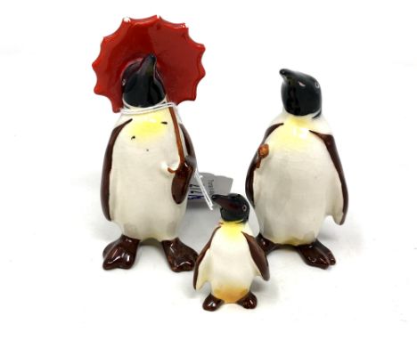 A Beswick china figure : Penguin (With Umbrella), model 802, black and white with yellow and red, gloss, height 11 cm, togeth