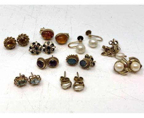 Ten pairs of gold earrings with studs including opal, amethyst, citrine, sapphire, amber etc CONDITION REPORT: 18.9g