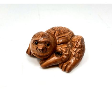A Japanese carved hardwood netsuke : Giant Turtle. 