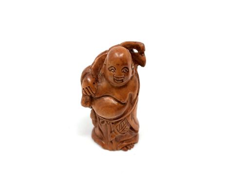 A Japanese carved hardwood netsuke : Pot-Bellied Man. 