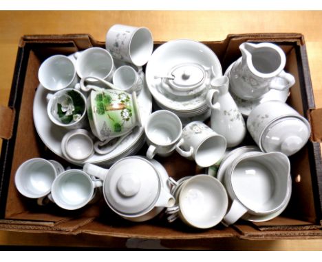 A box containing a Japanese tea service together with a further real porcelain floral patterned tea and dinner service  