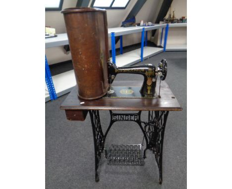 A 20th century Singer treadle sewing machine in table 