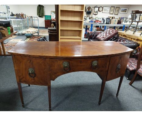 A 19th century bow front inlaid mahogany sideboard with lion mask handles    